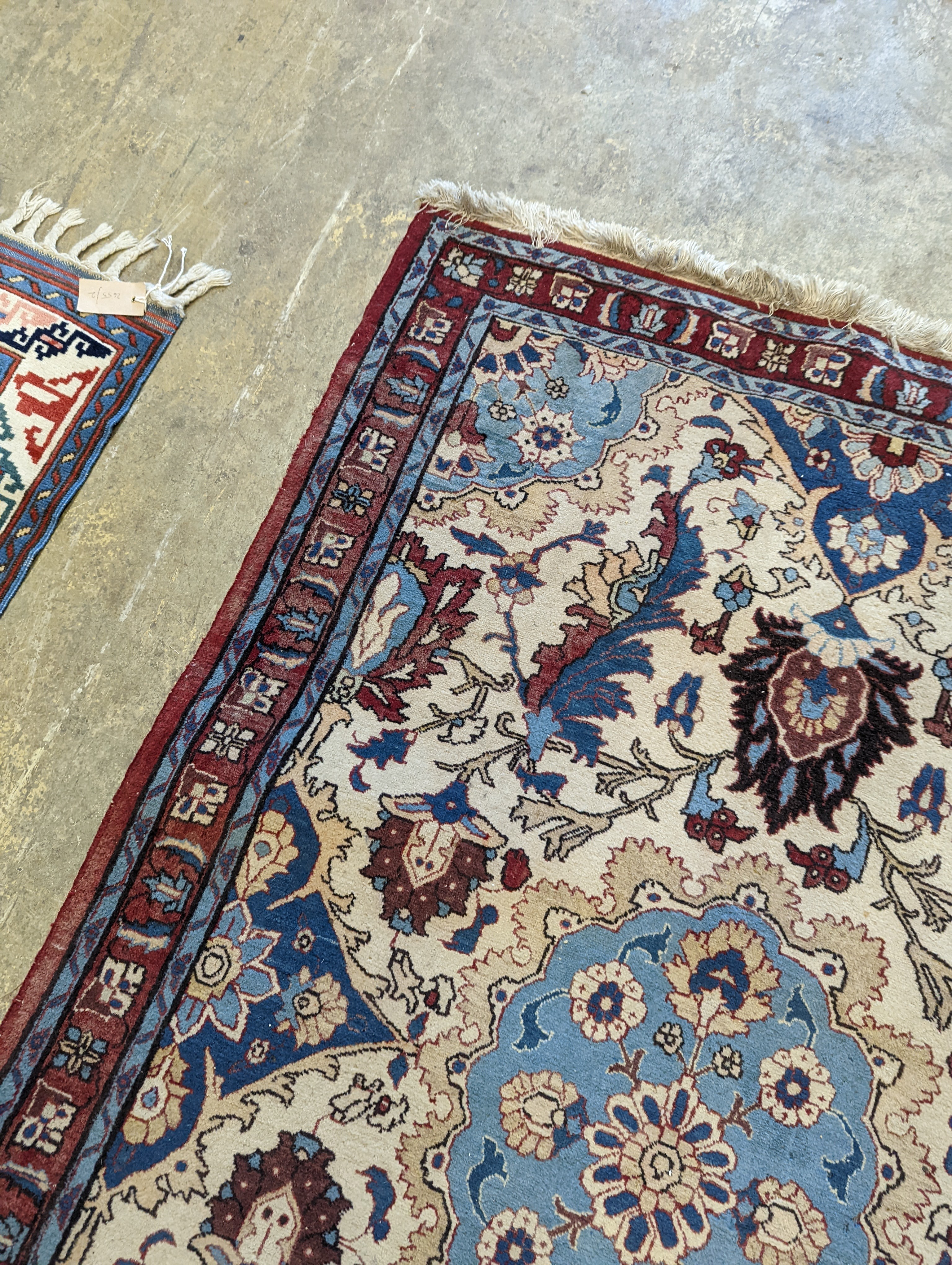 A North West Persian style ivory ground rug, 154 x 106cm